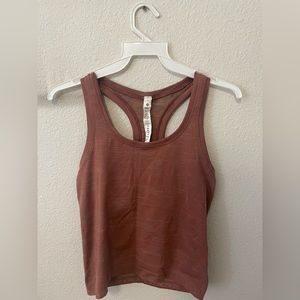 lululemon razorback tank brown with some hints of orange and blue in it. size 4